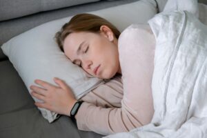 Woman sleeping in bed. Circadian rhythm optimization. Fight insomnia.Recovery of health in a dream